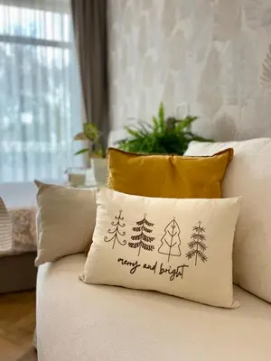 a pillow that says happy and bright on a couch at Coral Bay Studio Varna - Beachfront with Free Parking in Varna City