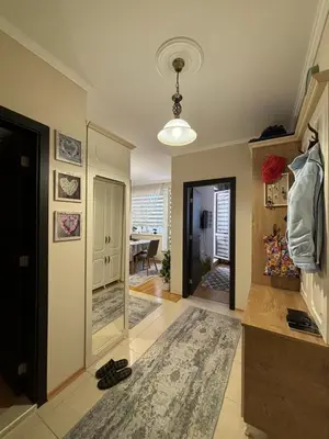 a living room with a hallway with a mirror at Apartment Rosa Marina in Nesebar