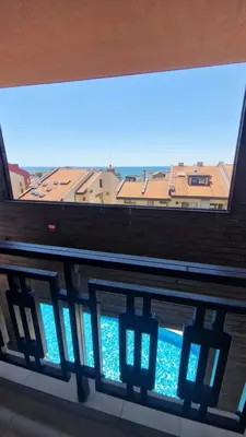 a view of the ocean from a window in a building at MitProt Panorama bay 2 Luks Apartment 175 in Sveti Vlas