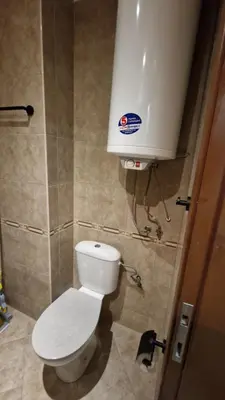 a bathroom with a toilet and a water tank at MitProt Panorama Bay 2 luks Studio 143 in Sveti Vlas