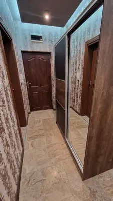 a hallway with a door and a mirror at MitProt Panorama Bay 2 luks Studio 143 in Sveti Vlas