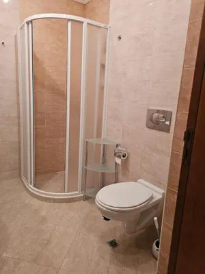 a bathroom with a toilet and a shower at KaliAnny in Santa Marina escape from daily routine in Sozopol