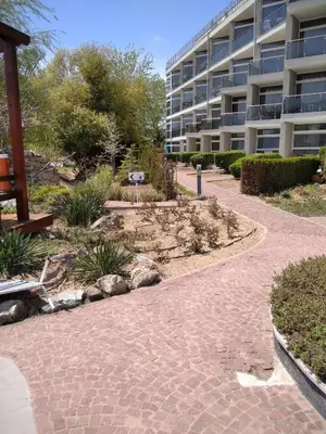 a brick walkway in front of a building at Studio Quatro - South Pearl - Sozopol in Sozopol