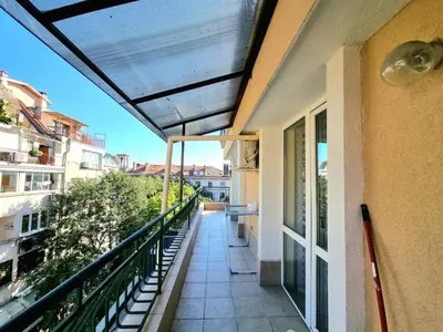 a balcony of a building with a view of a street at Sunny View Apartment with Garage in Burgas City