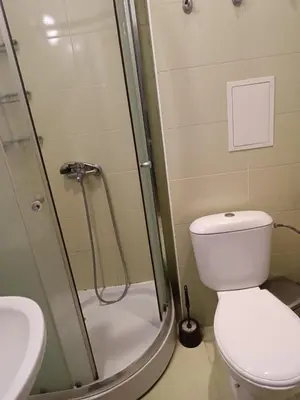 a bathroom with a shower with a toilet and a sink at Stamopolu apartament 1 in Primorsko
