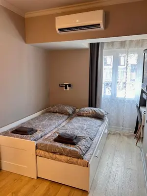 a bedroom with a large bed in a room at Sea Breeze l 2BD Sea Garden Apartment in Varna City
