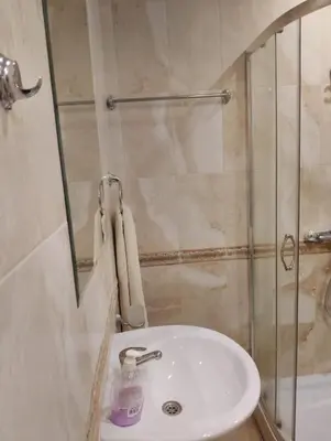 a bathroom with a sink and a shower at Studio Apartment Villa Sardinia Sveti Vlas in Sveti Vlas