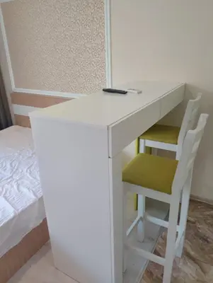 a white desk with two chairs and a bed at Studio Apartment Villa Sardinia Sveti Vlas in Sveti Vlas