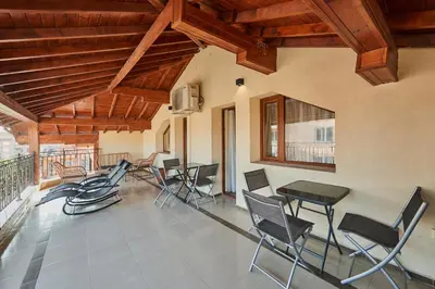 a group of chairs and tables in a room at Florance Rentals Luxury Apartments in Nessebar in Nesebar