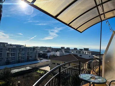 a balcony with a view of a city at Sea Sunrise Apartment in Burgas City