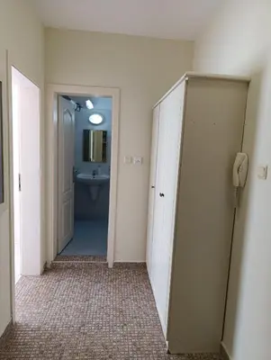 a bathroom with a toilet and a sink and a phone at Sunny Beach Center Apartment in Sunny Beach