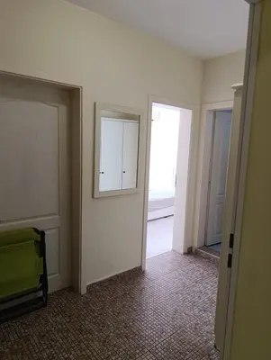 an empty room with two doors and a mirror at Sunny Beach Center Apartment in Sunny Beach