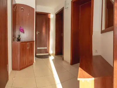 a room with a hallway with wooden cabinets and a hallwayngthngthngthngthngth at Nessebar's NEW Town TOP Centre 2-BDR Apartment by Flаt Manаger in Nesebar