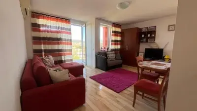 a living room with a couch and a table at Holiday Fort Golf Club MIA 2 in Sunny Beach
