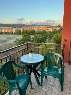 a table and two chairs on a balcony at Holiday Fort Golf Club MIA 2 in Sunny Beach