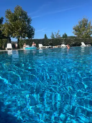 a pool of blue water with people swimming in it at Holiday Fort Golf Club MIA 2 in Sunny Beach