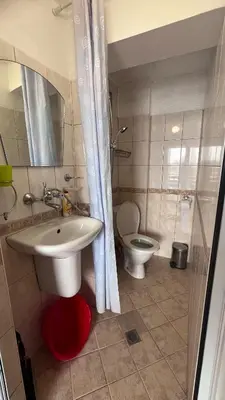 a bathroom with a sink and a toilet at Cozi 2BD Apartment with Sea View in the Old Town of Sozopol in Sozopol