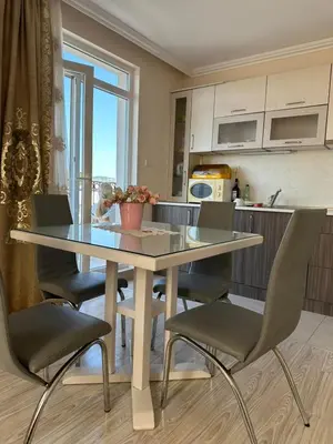 a kitchen with a table and chairs in a kitchen at Persani 3 Sanny Beach in Sunny Beach