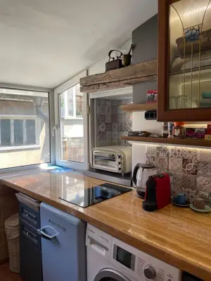 a kitchen with a counter and a stove top oven at Art Luxury studio in Burgas City