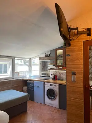 a kitchen with a washer and dryer in a room at Art Luxury studio in Burgas City