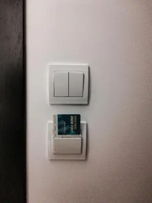 a white door with a clock and a book on it at Boho Studio 4 pools 10min to the beach in Burgas City