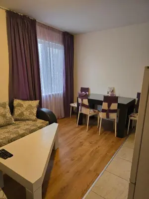 a living room with a couch and a table at Sea Diamond Family Suite in Sunny Beach