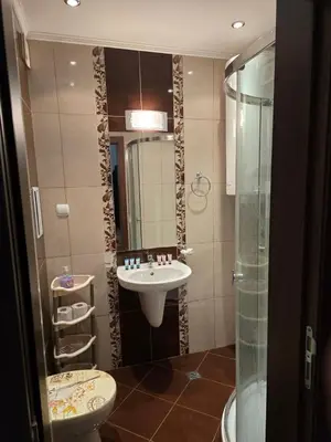 a bathroom with a sink and a toilet and a shower at Sea Diamond Family Suite in Sunny Beach