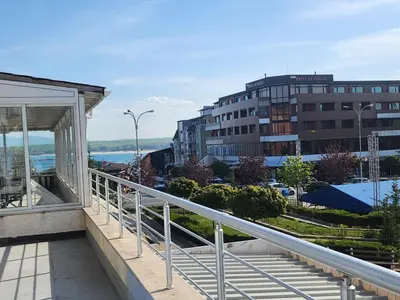a balcony with a view of a city at Апартамент на център Приморско in Primorsko