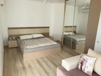 a small bedroom with two beds and a mirror at Modern Penthouse Apartment with full Sea View K&R in Sveti Vlas