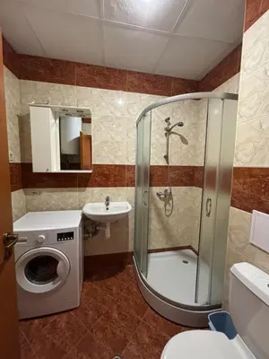 a bathroom with a shower and a sink at Privilege First Line Sea in Elenite