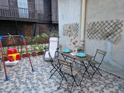a table and chairs sitting on a patio at Apartament Magi in Sozopol