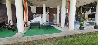 a patio with a ping pong table in a building at Amara Butik on the first line in Ravda