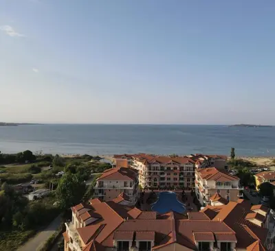 an aerial view of a resort near the ocean at Beach Front Luxury Apartment in Sozopol