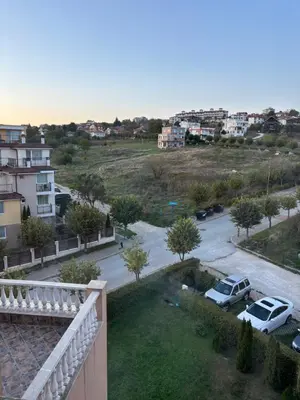 arial view of a street with a parking lot at Blue Bay Apartments in Byala