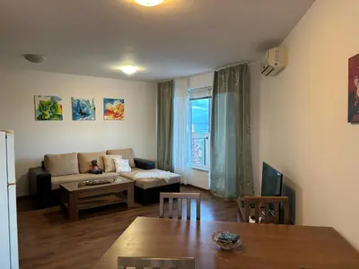 a living room with a couch and a table at Blue Bay Apartments in Byala