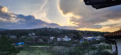 a view of a city with a rainbow in the sky at Hills view apartment in Sunny Beach