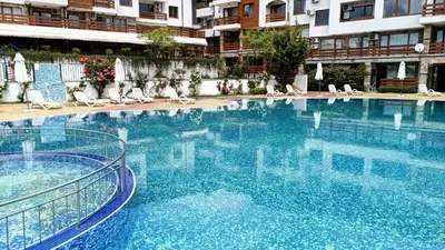 a large blue swimming pool in a building at Hills view apartment in Sunny Beach