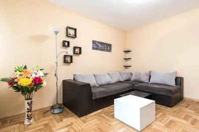 a living room with a couch and a table at Downtown Аpartment with Free Parking in Varna City