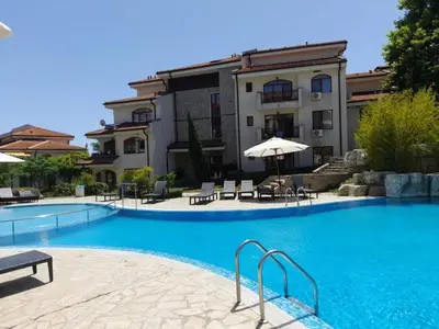 a large swimming pool in front of a building at Nice 2 Bedroom Apartment with Sea and Poolview near Aheloy in Kableshkovo