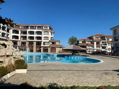 a large swimming pool in front of a building at The Vineyard Spa&Resort Apartment with private garden near Aheloy in Kableshkovo