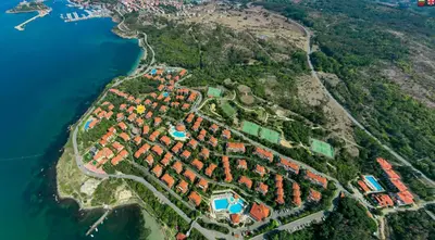 an aerial view of a resort on a hill next to the water at AJ Apartment 8, Santa Marina Holiday Village, Sozopol in Sozopol