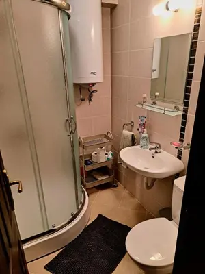 a bathroom with a sink and a toilet and a shower at Nessebar Apartment Pablo in Sunny Beach