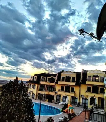 a large apartment building with a pool in front of it at Nessebar Apartment Pablo in Sunny Beach