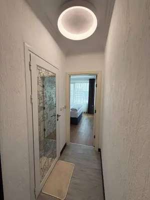 a hallway with a door leading to a bedroom at Aparthotel Sveti Nikola in Pomorie