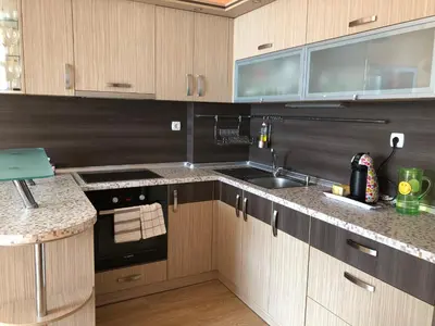 a kitchen with a sink and a stove top oven at 2 bedroom apartment komplex Andalusia Elenite with terrasa and sea in Sveti Vlas