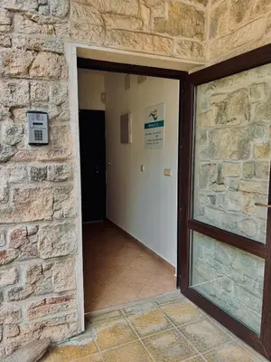 an entrance to a building with a brick wall at Sozopol Dreams Apart&FREE Parking in Sozopol