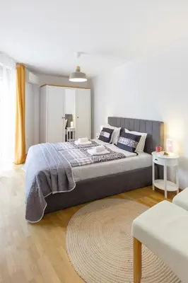 a bedroom with a large bed in a room at Lidia Odrin by RV Apartments in Varna City