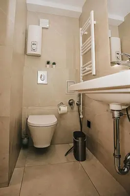 a bathroom with a toilet and a sink at The Loft - Parking - Washer&Dryer - Port view - Balcony in Burgas City