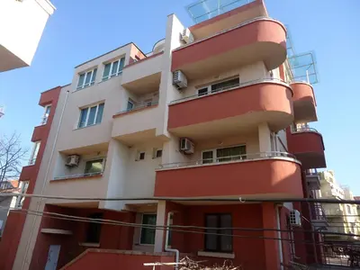 a building with red and white at Тихия кът in Sozopol