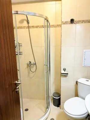 a bathroom with a shower and a toilet at La Dahlia studio - Cascadas family resort in Sunny Beach